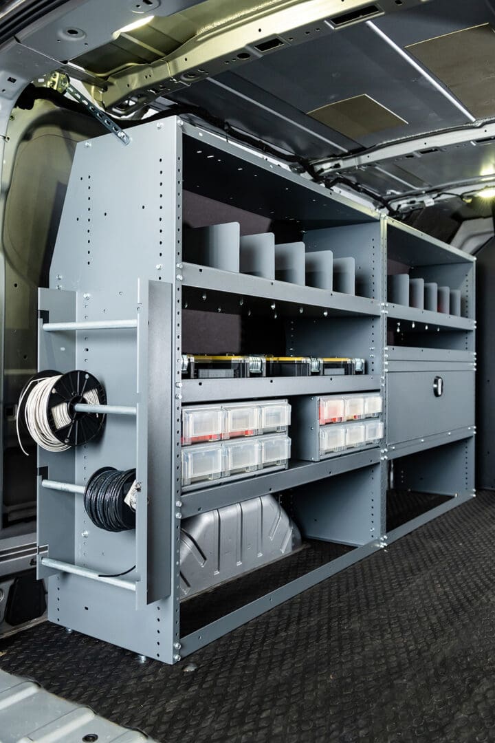 A storage area with shelves and bins in it.